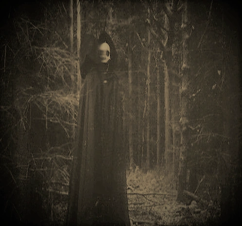 Cloaked figure